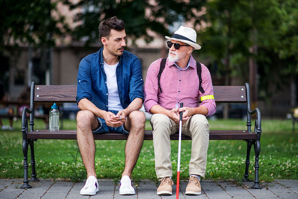 Blind person sitting on a bench Blind person sitting on a bench